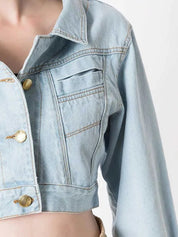 Light blue cropped denim jacket with gold-tone buttons