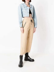 Light blue cropped denim jacket with gold-tone buttons