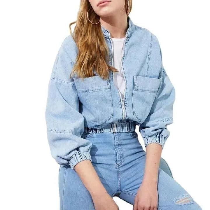 Light blue cropped denim jacket with zip front and patch pockets