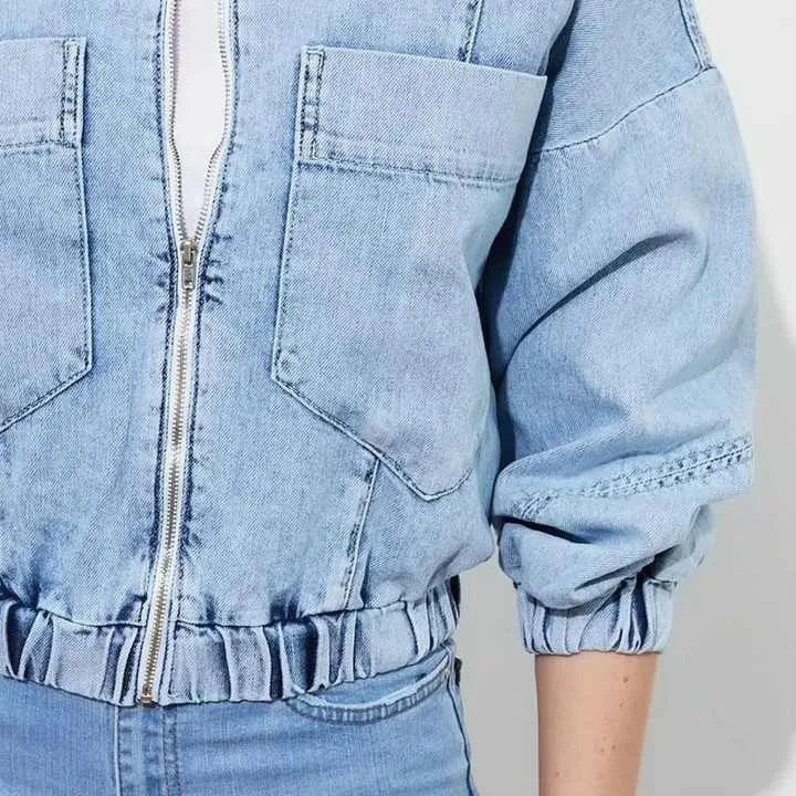Light blue cropped denim jacket with zip front and patch pockets