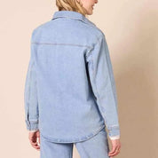 Light blue denim shirt jacket with flap chest pockets